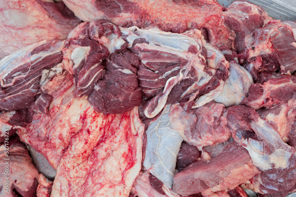 A close up portrait and texture of raw lamb meat at the Feast of Qurban during Eid Al Adha Al Mubarak.