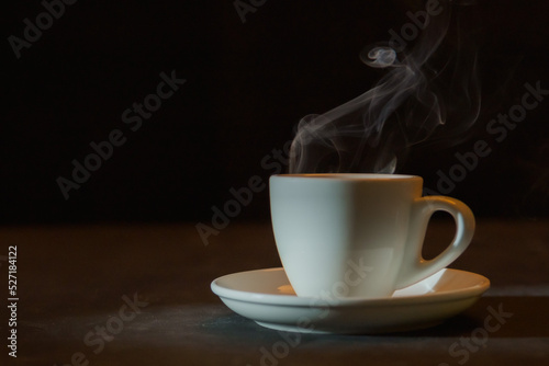 Mug on a table, from it there is steam.