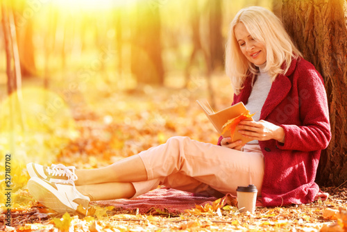 Mature woman reading book n...