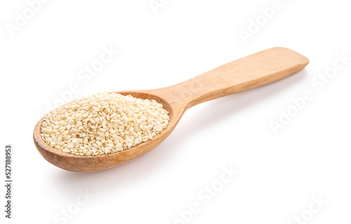 Wooden spoon with sesame seeds on white background