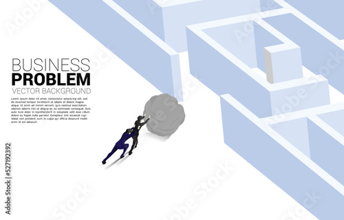 Silhouette of businessman pushing the rock to enter to maze. Concept of business challenge and work hard.