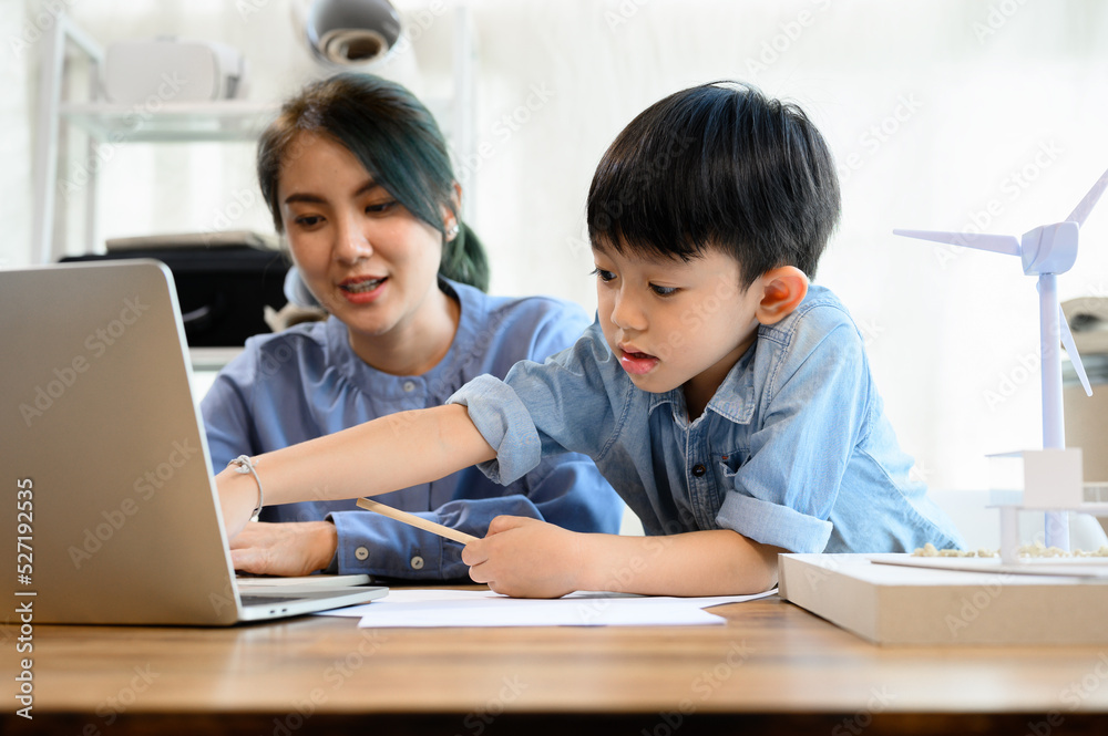 Little kid son interrupting mother's working at home office Little kid son interrupting mother's working at home office