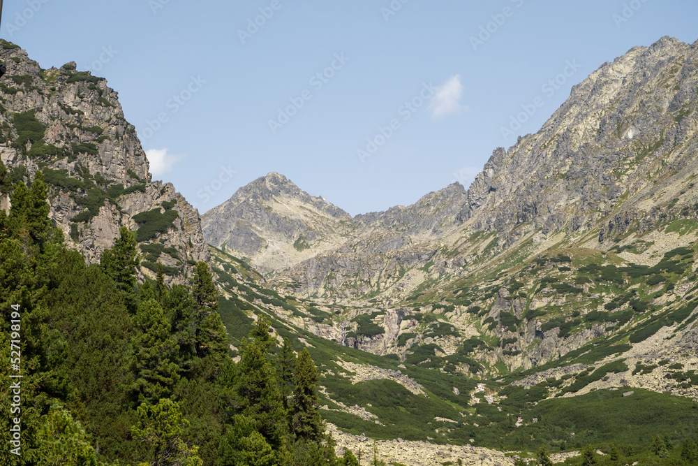 Hot summer day. Mountain landscape with the huge rocky slopes of the High Tatras, Slovakia