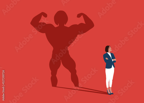 Businesswoman dreams of becoming a bodybuilding. Confident handsome young woman standing bodybuilding shadow concept illustration.