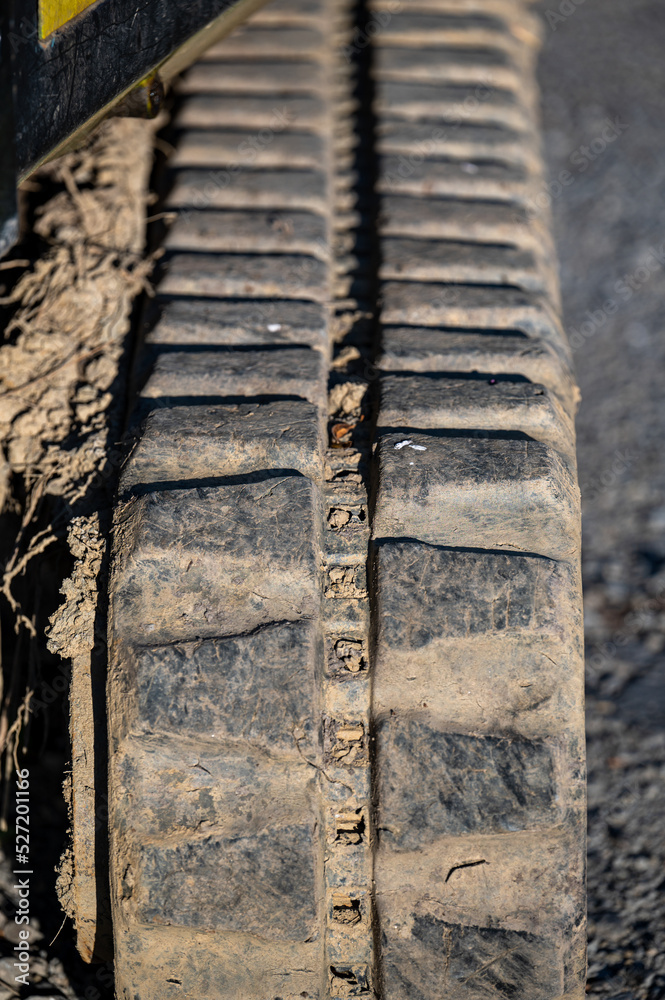 Close-up of the caterpillar of a small excavator. Close-up of the caterpillar of a small excavator.