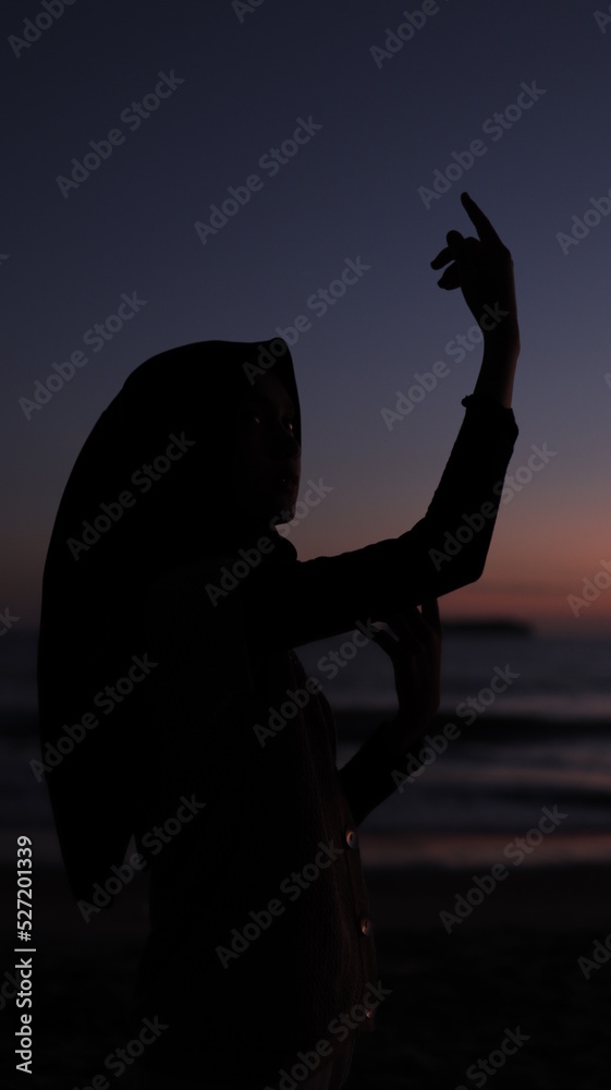 silhouette of a person on the beach at sunset silhouette of a person on the beach at sunset