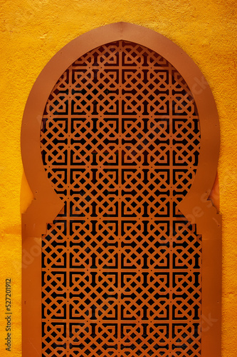 Photography Traditional Arabian architecture, muslim style window and red clay wall