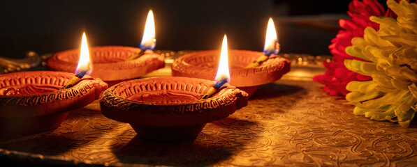 Diwali, Deepavali Hindu festival of lights. Diya lamp on Puja thali, overhead