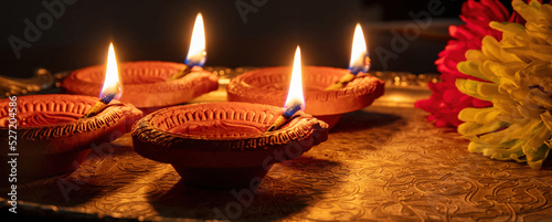 Diwali, Deepavali Hindu festival of lights. Diya lamp on Puja thali, overhead photo