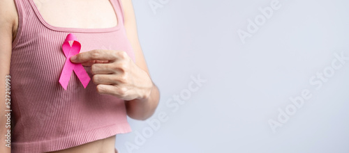 Wallpaper Mural Pink October Breast Cancer Awareness month, woman hand hold pink Ribbon and wear shirt for support people life and illness. National cancer survivors month, Mother and World cancer day concept Torontodigital.ca