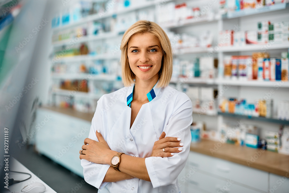 Portrait of confident female pharmacist looking at camera.