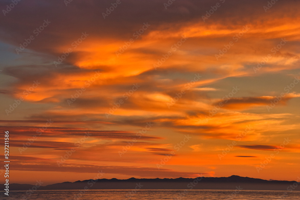 Obraz premium Passing winter storm at sunset on the beach in Montecito California