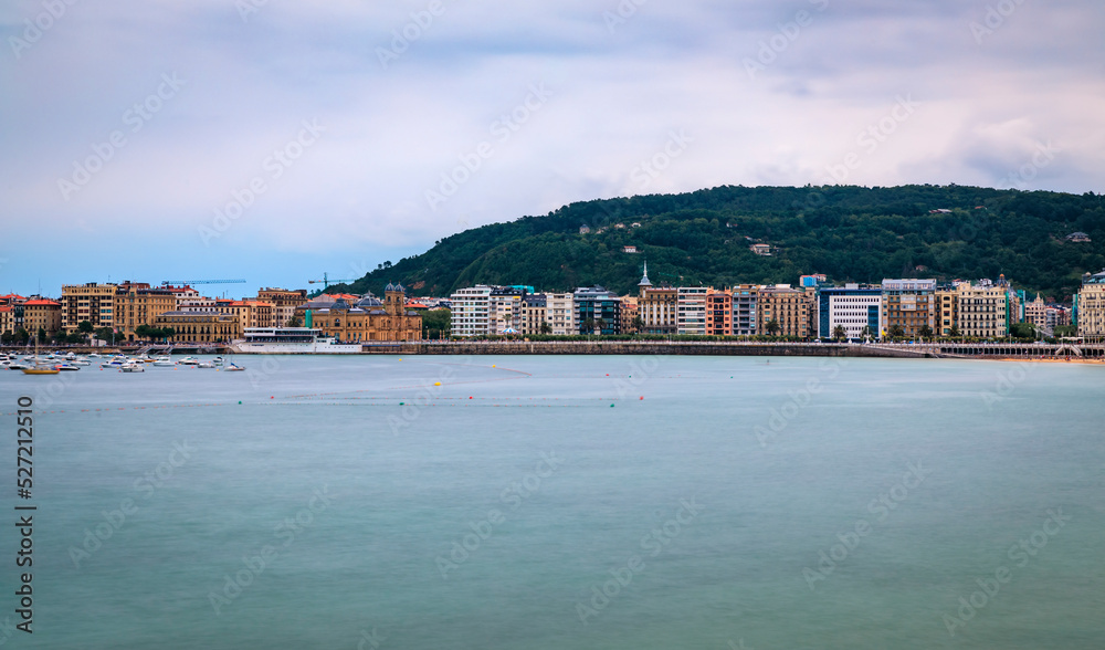 Panorama of La Concha bay, beach and waterfront houses in San Sebastian, Spain
