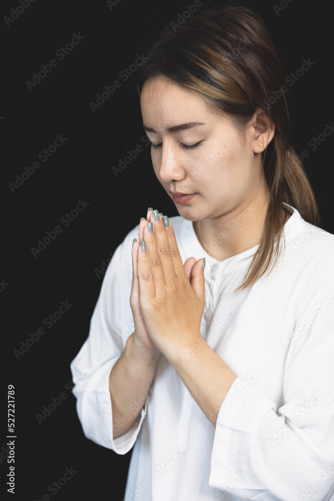 woman Praying hands with faith in religion and belief in God On the morning sunrise background. Namaste or Namaskar hands gesture, Pay respect, Prayer position. woman Praying hands with faith in religion and belief in God On the morning sunrise background. Namaste or Namaskar hands gesture, Pay respect, Prayer position.