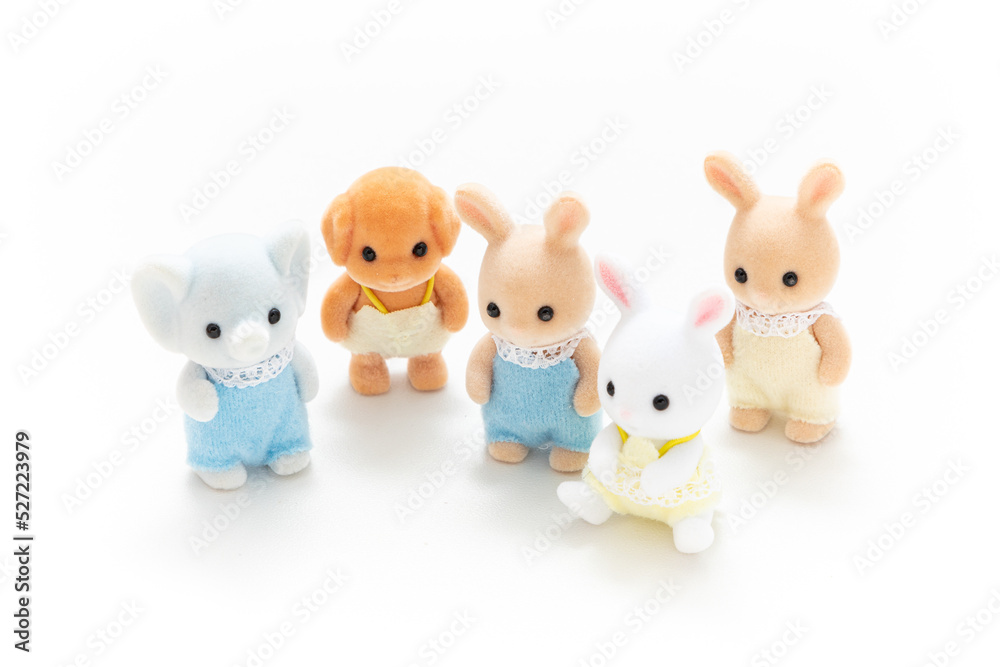 Animal doll isolated on white background. Miniature dollhouse toy. Kids toy. Animal character. Play and learn. Kids room. Childhood. Kindergarten toy. Developmental toys.
