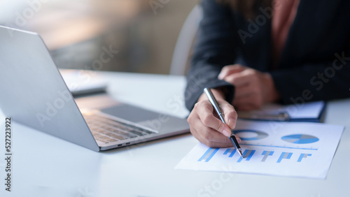 Φωτογραφία Auditor is examining the financial statement documents using a calculator calculate monthly expenses, manage budget, income tax, budget, documents, credit documents, invoices