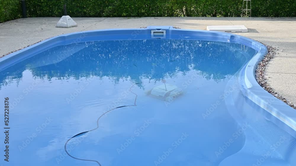 Robotic pool cleaner during on duty. Robotic is solutions for swimming ...