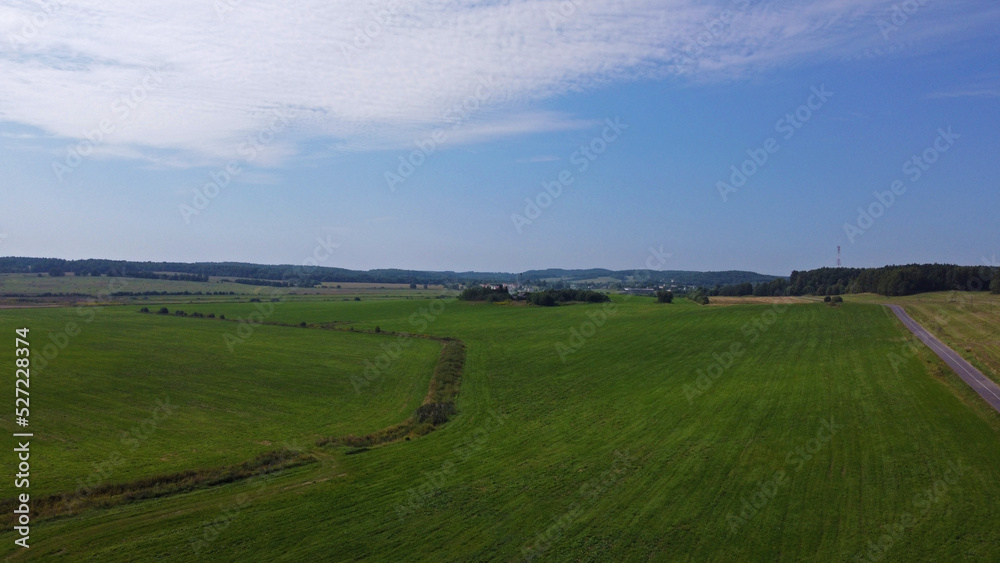 Naklejka premium Aerial view of agro rural fields. Harvesting on the farm landscape