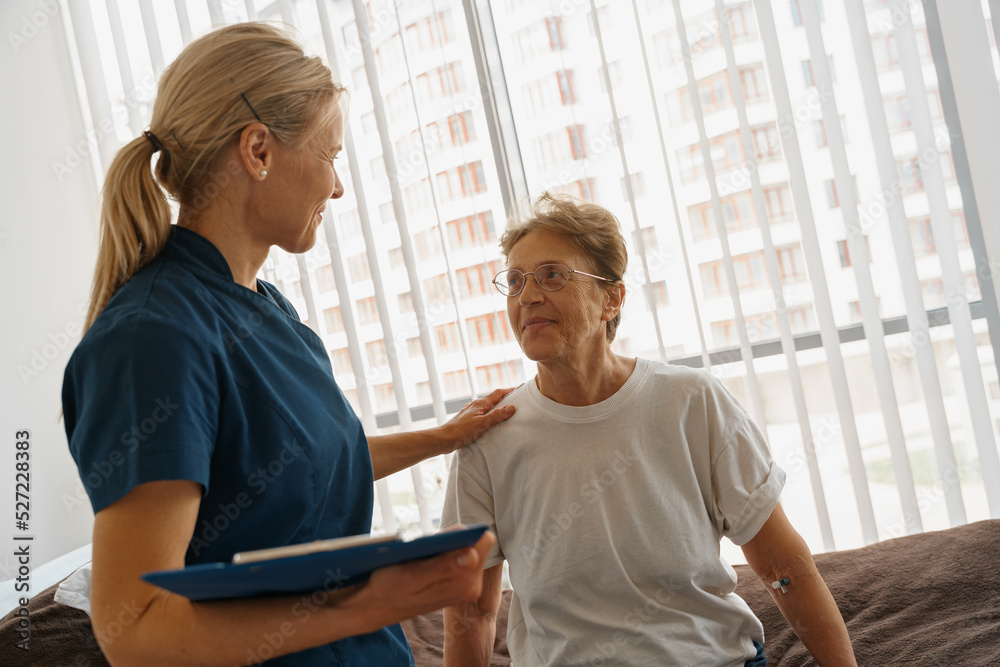Doctor supporting a sick patient before medical procedures in a hospital ward. High quality photo Doctor supporting a sick patient before medical procedures in a hospital ward. High quality photo
