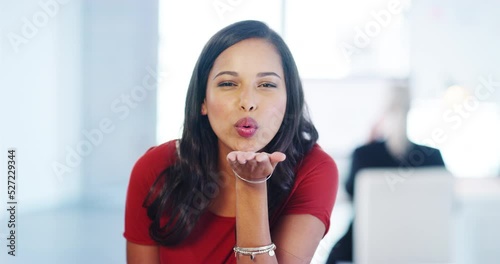 Love and beauty business woman with kiss emoji hand gesture in a office workplace. Young beautiful or flirty female portrait with happy smile and kissing sign or icon for valentines day