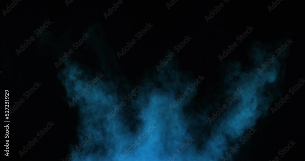 Powder particles explode from the bottom up on a black background. The dust flies in different directions. Powder particles explode from the bottom up on a black background. The dust flies in different directions.
