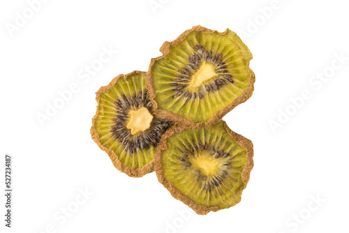 three slices of dried kiwi fruit isolated on white