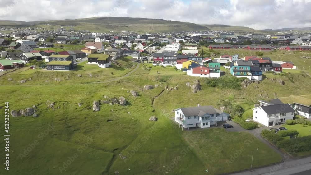 Faroe Islands shoreline town panorama filmed by drone Faroe Islands shoreline town panorama filmed by drone
