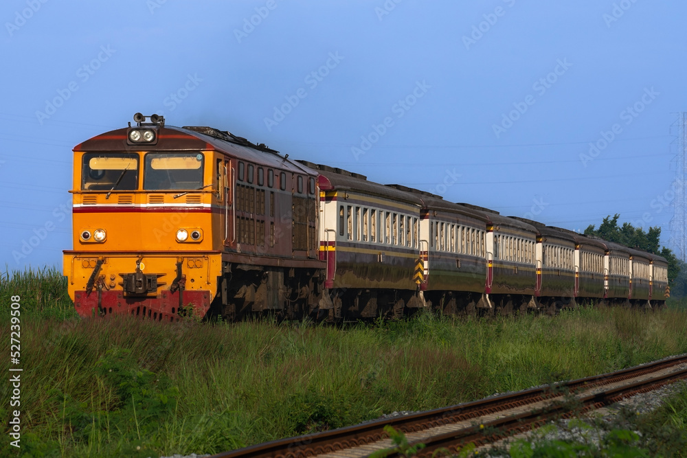 Passenger train by diesel locomotive on the railway. Passenger train by diesel locomotive on the railway.