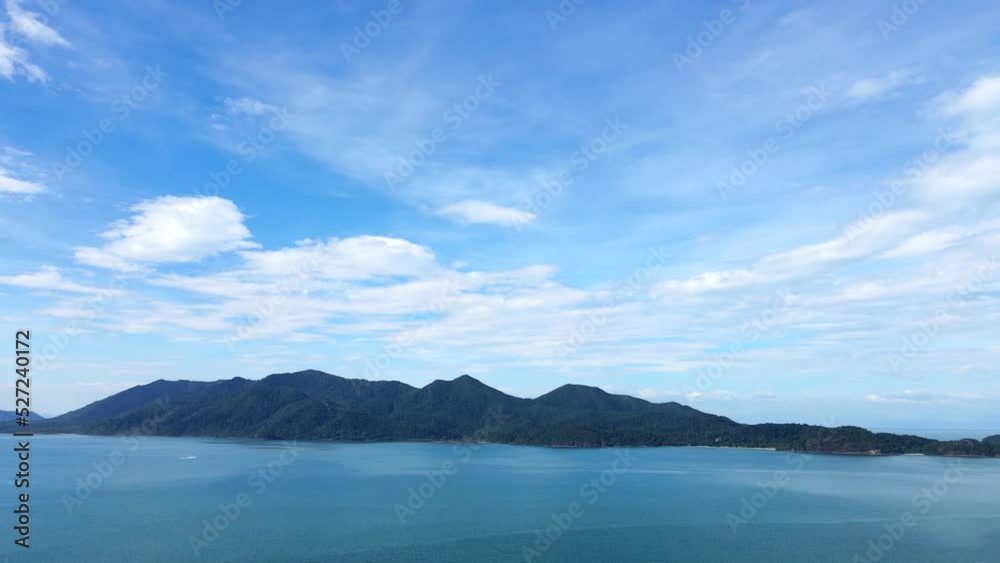 High-angle view overlooking the sea mountain view blue sky and calm water. High-angle view overlooking the sea mountain view blue sky and calm water.