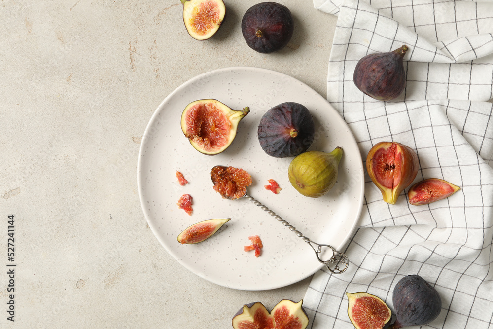 Flat lay composition with delicious figs on light grey table Flat lay composition with delicious figs on light grey table