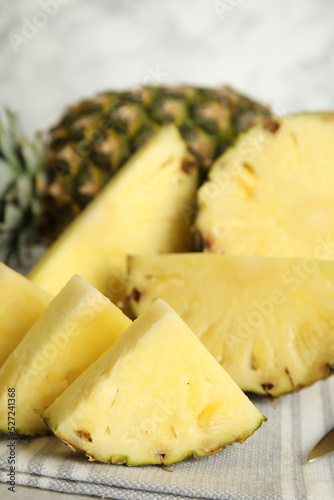 Slices of fresh juicy pineapple on table, closeup