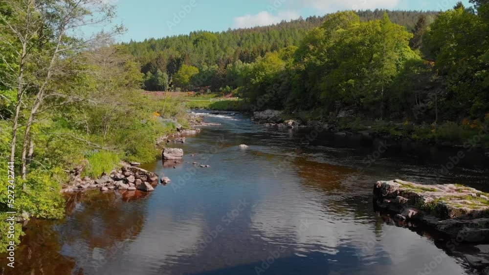Drone shot flying below bridge arch above highland river in Scotland. Drone shot flying below bridge arch above highland river in Scotland.