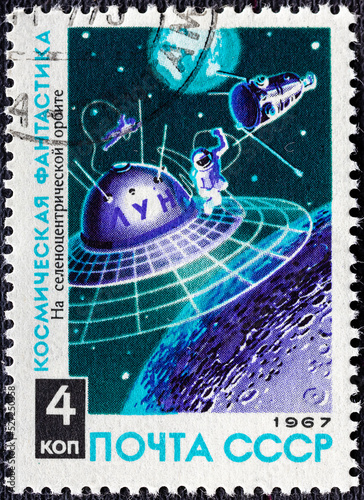RUSSIA - CIRCA 1967: a stamp printed in the Russia shows Space Station Orbiting Moon, Science Fiction.