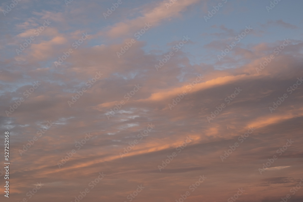 Majestic cloudy sunset at dusk dramatic skyscape. Amazing clouds with orange light of nature Majestic cloudy sunset at dusk dramatic skyscape. Amazing clouds with orange light of nature