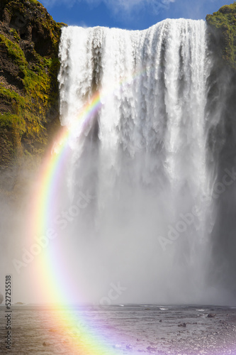 Icelandic Landscape concept - View of famous Skogafoss waterfall with amazing rainbow