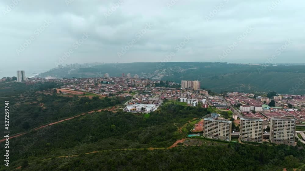 Wide Aerial view of Achupallas neighborhood on a forested hilltop on Cloudy day, Chile Wide Aerial view of Achupallas neighborhood on a forested hilltop on Cloudy day, Chile