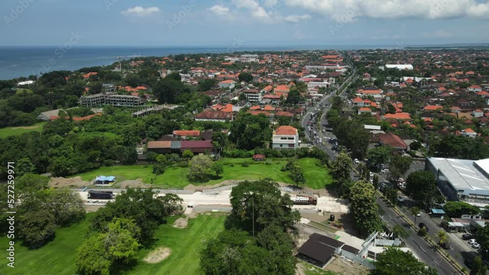 Sanur, Bali Island, Indonesia. Aerial View of Green Fields, Bypass Road Traffic and Ocean Horizon Sanur, Bali Island, Indonesia. Aerial View of Green Fields, Bypass Road Traffic and Ocean Horizon