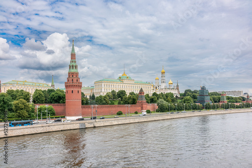 View of Kremlin with Vodovzvodnaya tower, Grand Kremlin Palace from repaired Bolshoy Kamenny Bridgein Moscow city on sunny summer day photo