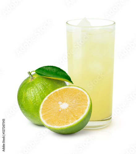 Glass of bitter orange juice and fresh Aurantium citrus (Seville orange) with green leaf isolated on white background. photo