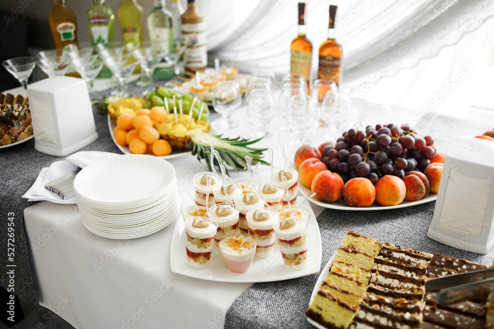 Buffet table..Fruits and pieces of cakes of various types, Buffet table..Fruits and pieces of cakes of various types,