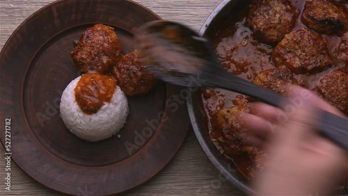 Wallpaper Mural Boiled rice for garnish and meatballs in a thick red sauce. Torontodigital.ca