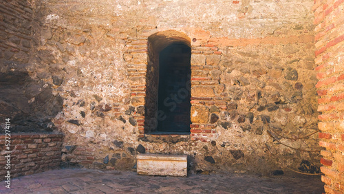 Old door and wall in Alcazaba, Malaga, Spain photo
