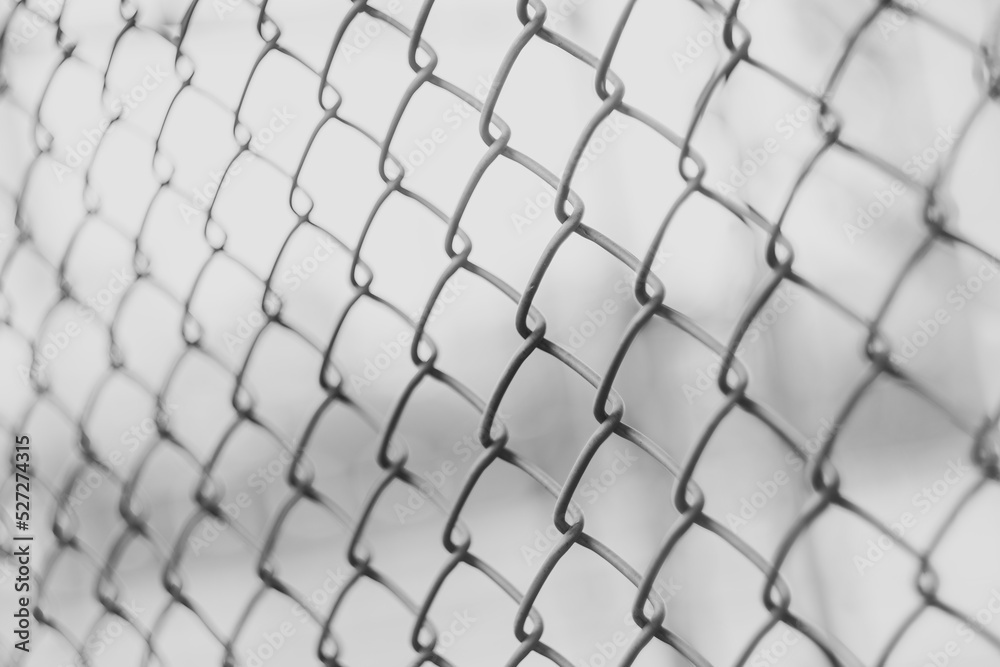 Fototapeta premium Close-up chain link fence , Sunset background