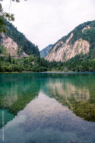 Jiuzhaigou in Sichuan province is a famous tourist base with its natural scenery. Vertical image photo