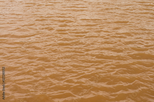 Background lake surface ferrous brown water from coal mining pit water eternity burdens photo