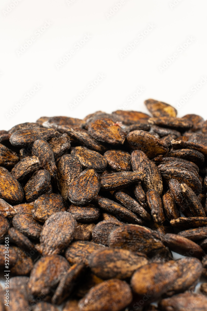 Dried watermelon seeds on a white background macro top view.