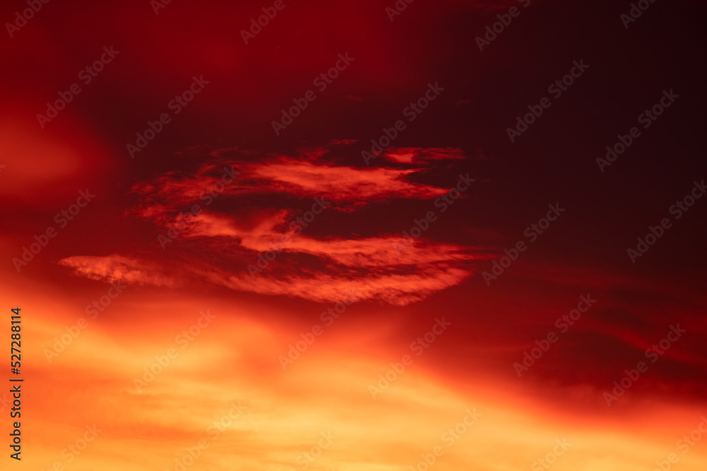 Beautiful burred gradiant orange clouds and sunlight on the blue sky perfect for the background, take in everning,Twilight, rainy season,winter, summer