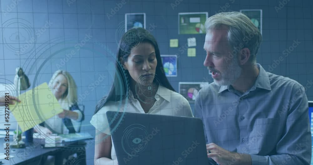 Animation of data processing over businessman using laptop Animation of data processing over businessman using laptop