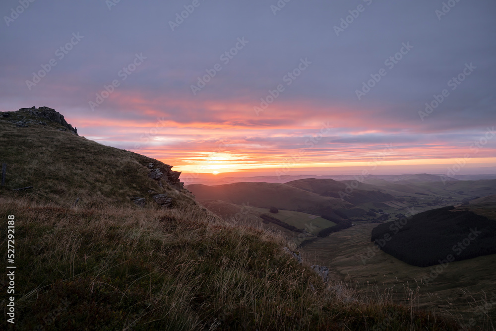 Sunrise over Cadair Berwyn mountain summit in Wales UK