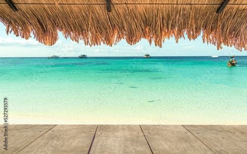 Fototapeta Naklejka Na Ścianę i Meble -  Gaussian Blur image hut on the sand beach to see the blue aqua seascape represent minimal summer vacation time slow and easily relaxation seaside in a happy holiday.